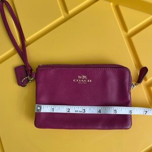 Coach wristlet-used maroon/purple with interior card sleeves.